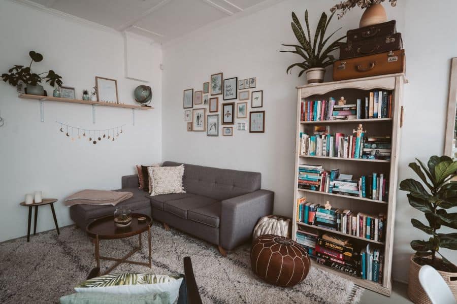 vintage living room with bookcase and gray sofa 
