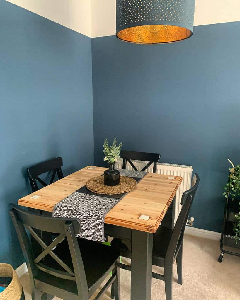 blue wall corner table and chair dining room