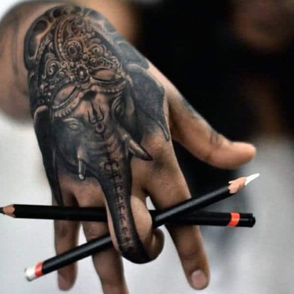 Ganesh Elephant Trunk Finger And Hand Tattoo On Man