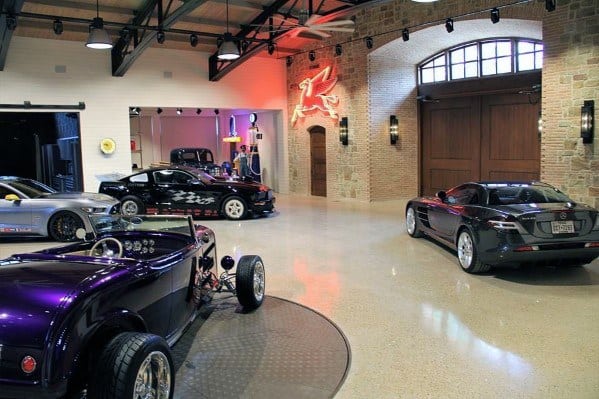 modern garage with stone wall classic cars