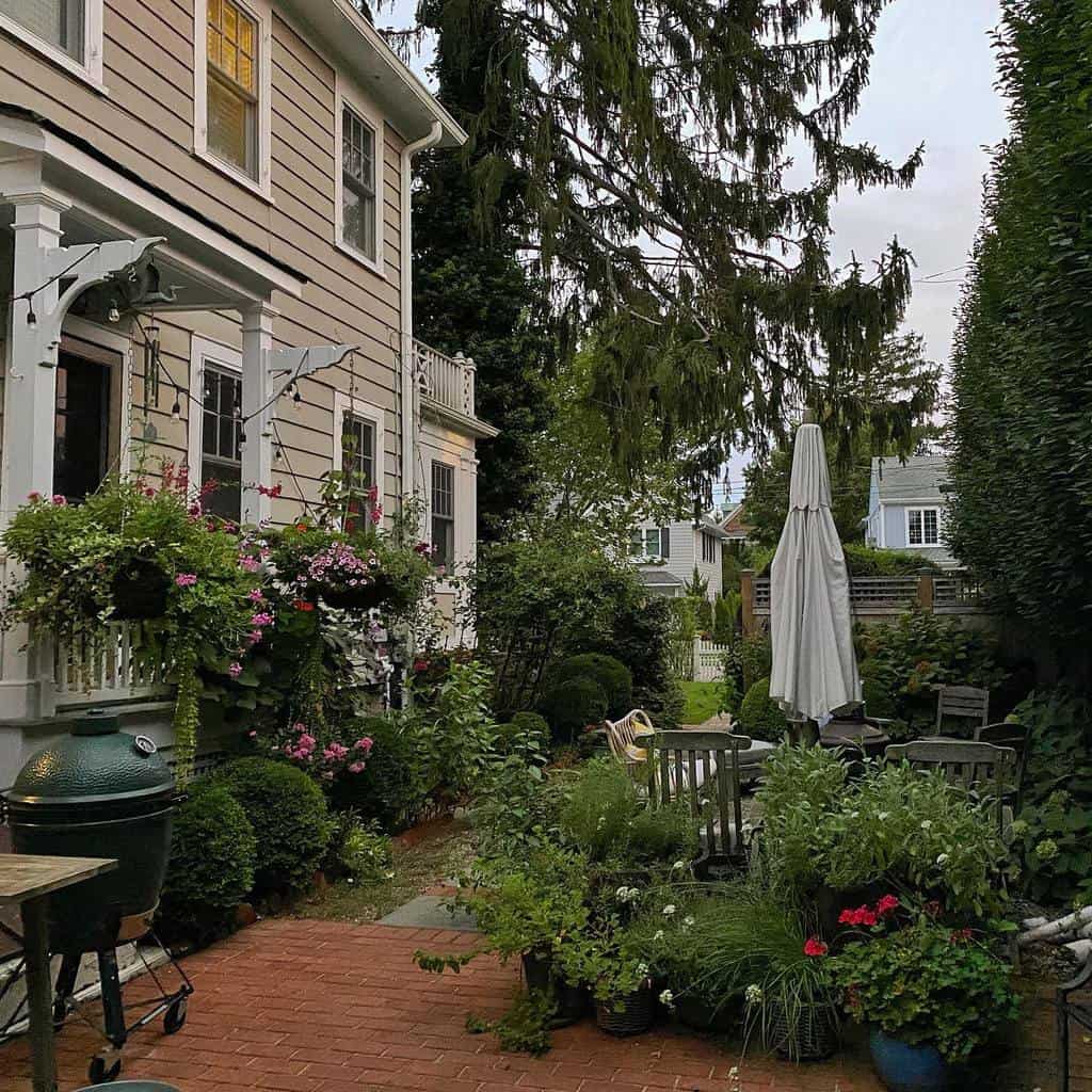 backyard garden with brick paver patio