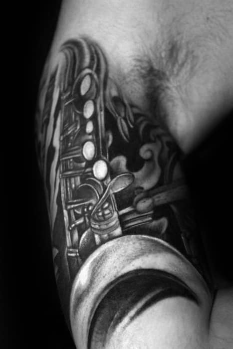 Gentleman With 3d Saxophone Inner Arm Bicep Tattoo