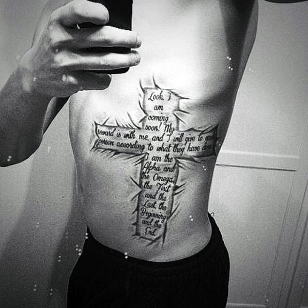 Gentleman With Bible Verse Tattoo On Ribs With Cross And Ripped Skin Design