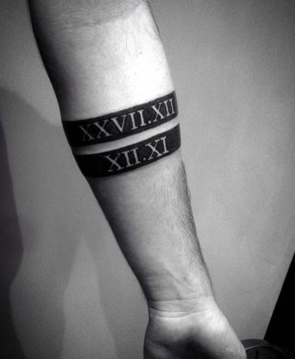 Gentleman With Black Band Roman Numerals Forearm Tattoo