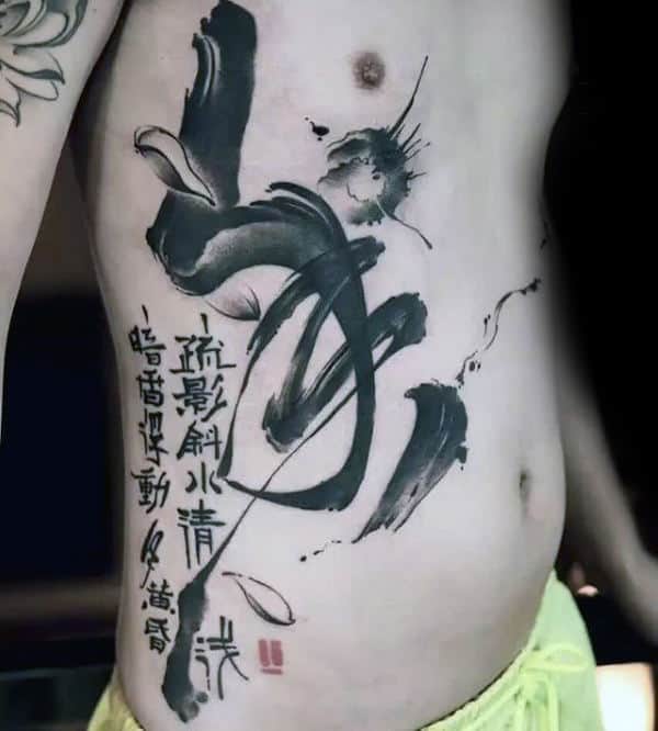 Gentleman With Black Ink Paint Brush Stroke Chinese Writing Tattoo On Rib Cage Side