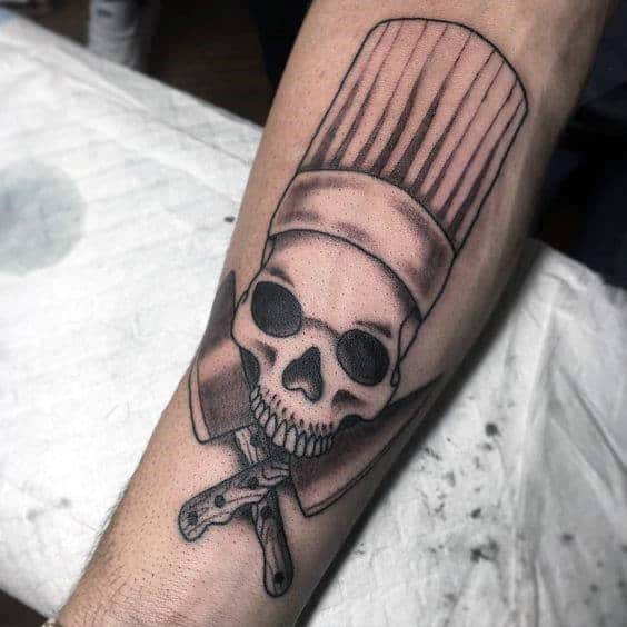 Gentleman With Chef Knife And Skull Arm Tattoos