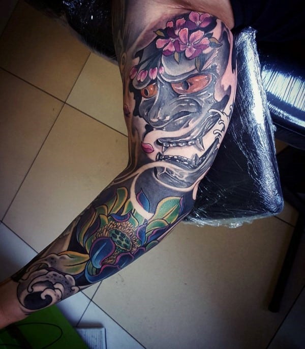 Gentleman With Cherry Blossom Flower And Demon Mask Sleeve Tattoo