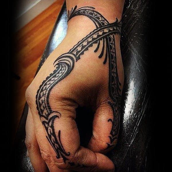gentleman-with-cool-black-ink-tribal-hand-tattoo