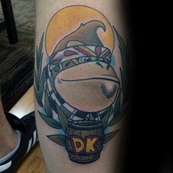 Gentleman With Donkey Kong Tattoo On Back Of Leg