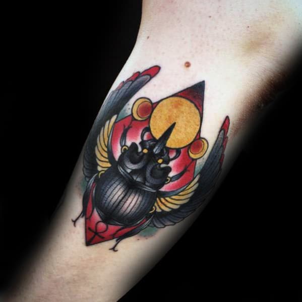 gentleman with inner arm bicep traditional scarab bettle tattoo