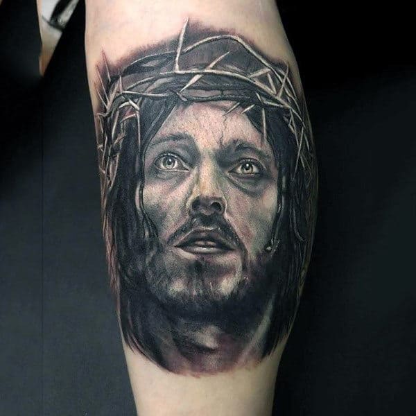 Gentleman With Jesus Christ Face Tattoo On Leg Calf
