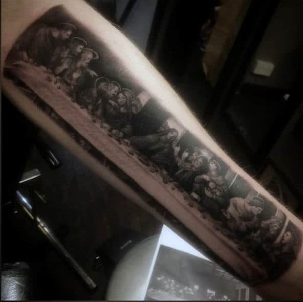 Gentleman With Last Supper Religous Tattoo On Forearm