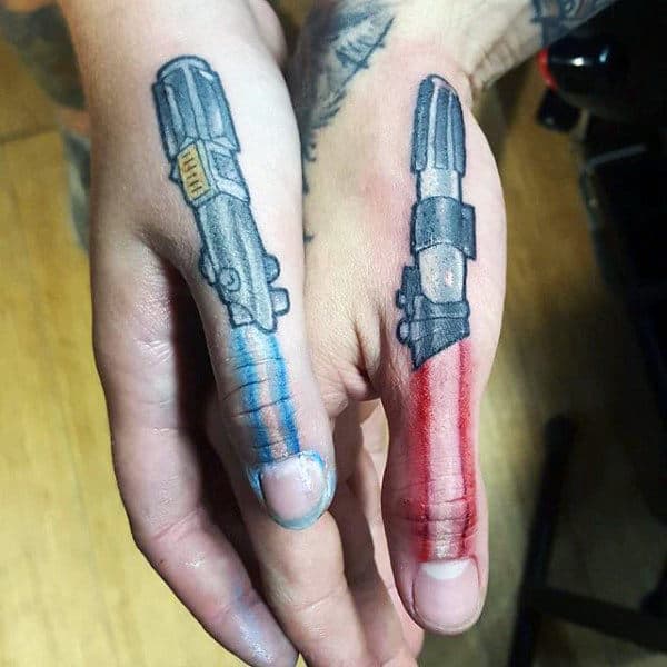 Gentleman With Lightsabers Tattooed On Fingers.