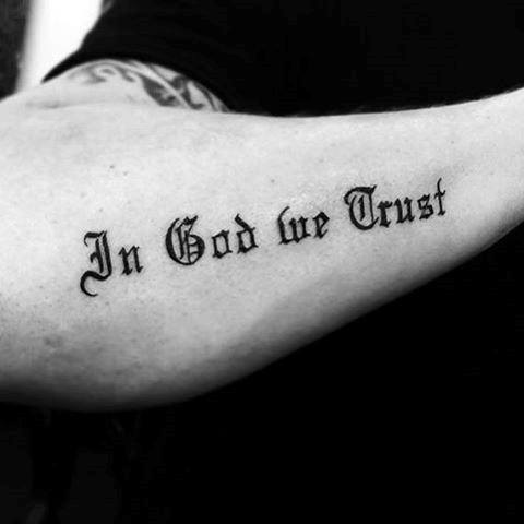 Gentleman With Old English In God We Trust Outer Forearm Tattoo.