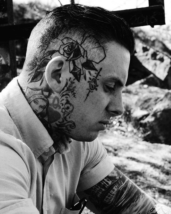 Gentleman With Old School Rose Flower And Sword Tattoo On Face