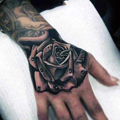 Gentleman With Realistic Rose Tattoo With Water Droplets And Shaded Black And Grey Ink
