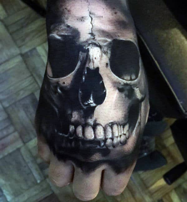 Gentleman With Realistic Skull Teeth Tattoo On Hand