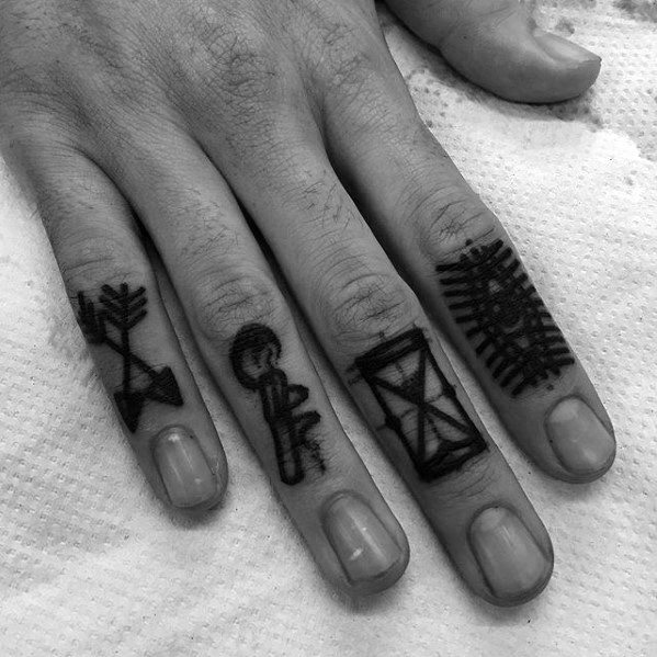 Gentleman With Small Arrow Tattoo On Fingers