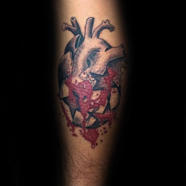 Gentleman With Soccer Heart Tattoo On Leg