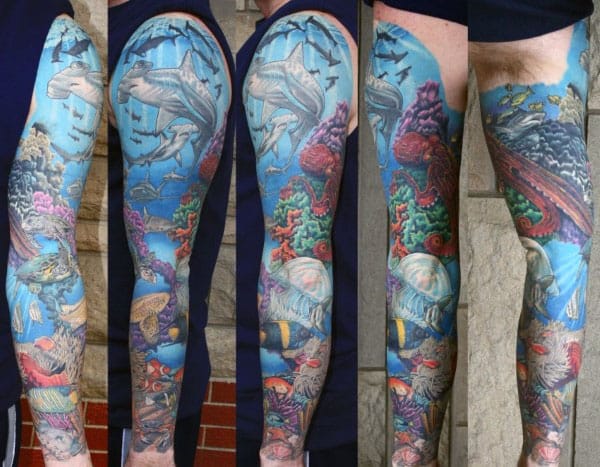 Gentleman With Tattoo Sleeve Of Coral Reef And Ocean