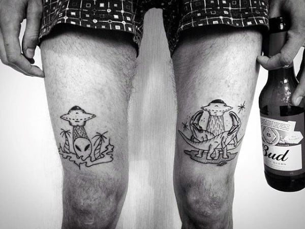 Gentleman With Thigh Tattoos Of Aliens