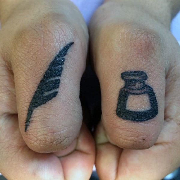 Gentleman With Thumb Tattoo Of Pen And Ink Bottle