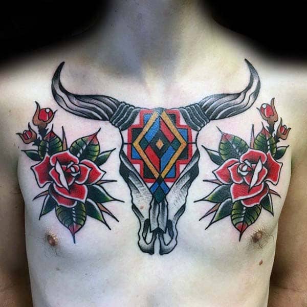 gentleman-with-traditional-bull-skull-and-rose-flowers-tattoo-on-upper-chest