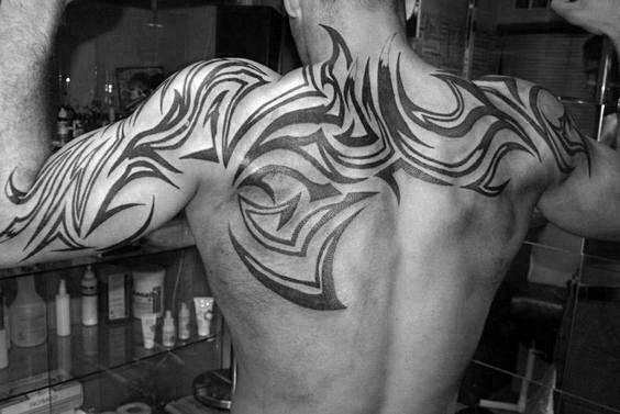 Gentleman With Tribal Back Tattoo
