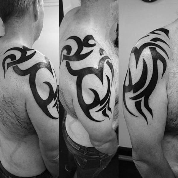 Gentleman With Tribal Shoulder Traditional Tattoo Solid Black Ink Design