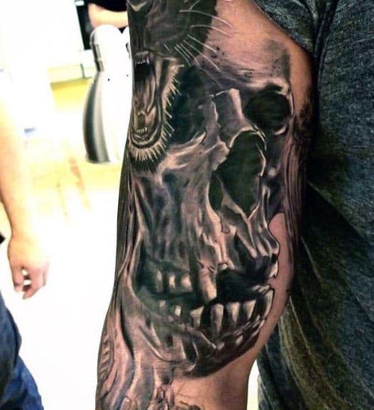 Gentlemen With Bicep Tattoos Skull