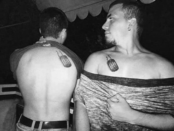 gentlemen with matching brother dog tag tattoos