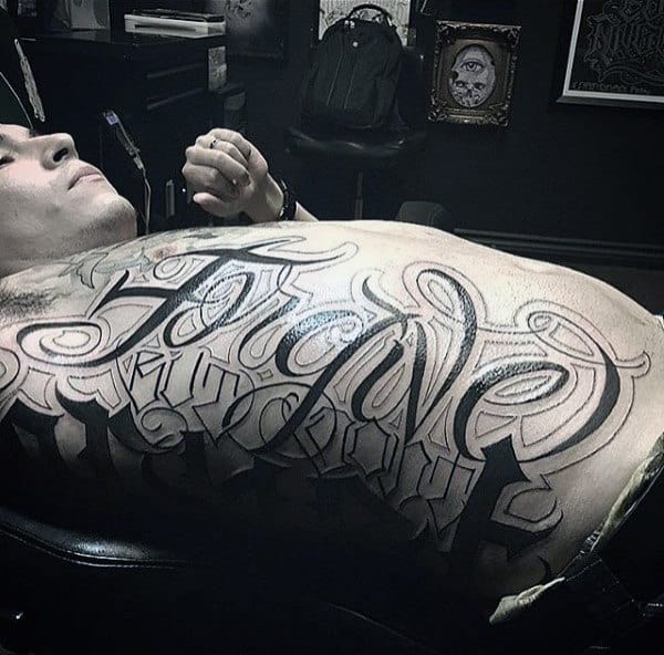 Gigantic Lettering Tattoo Males Torso