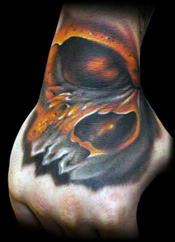 Glowing Grey And Orange Mens Awesome Skull Hand Tattoo Design Inspiration