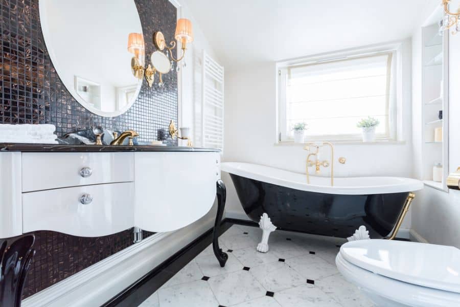 black and white bathroom with gold accent