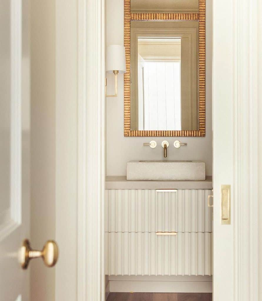 luxury powder room with gold accents 