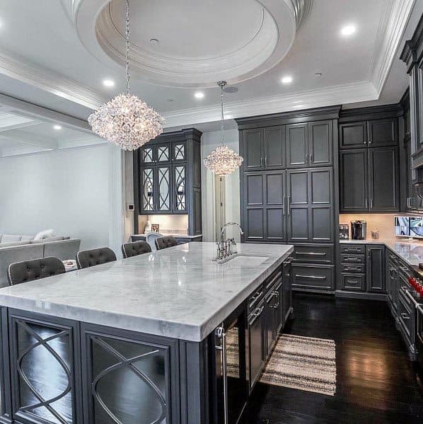 grey kitchen with crystal chandelier