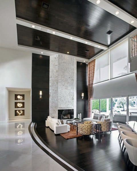 lavish living room wood and marble floors stone fireplace wood ceiling recessed lights