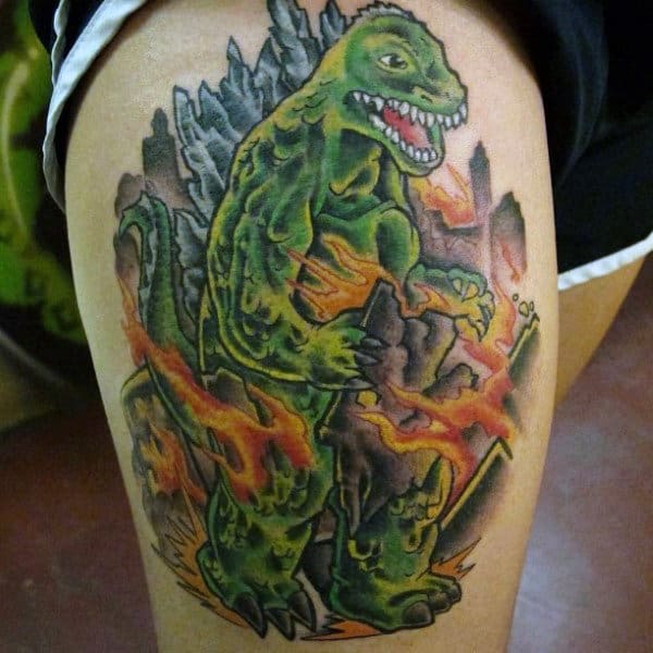 Green Cartoon Style Godzilla In Flames Tattoo For Men