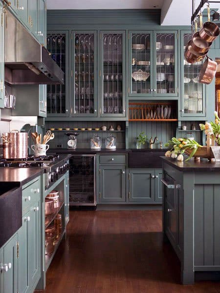 country style kitchen with green glass cabinets 