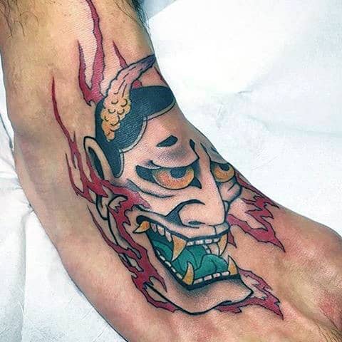 Green Tongued Ogre Tattoo On Foot For Men