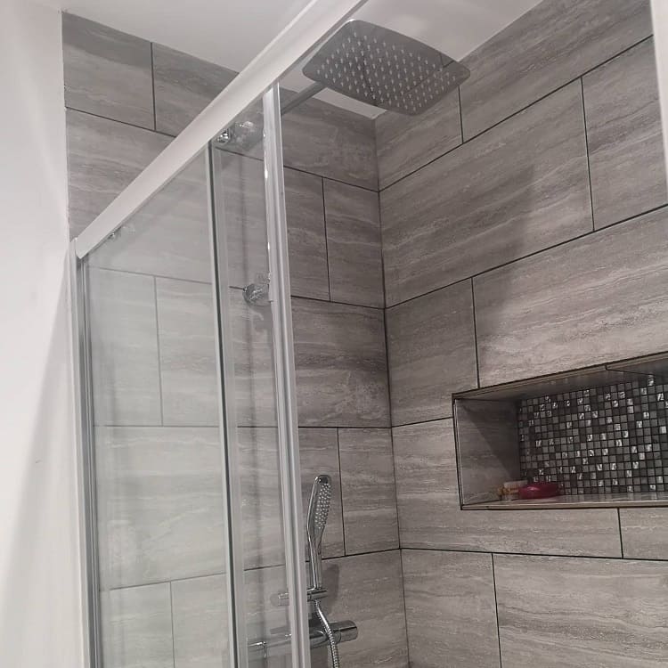 modern shower with grey tiles