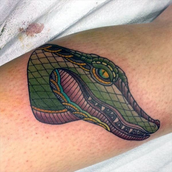 Guy With Alligator Head Tattoo On Arms
