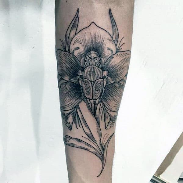 Guy With Bettle Orchid Flower Inner Forearm Tattoo
