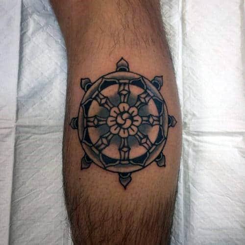 Guy With Blue And Black Ink Dharma Wheel Leg Calf Tattoo
