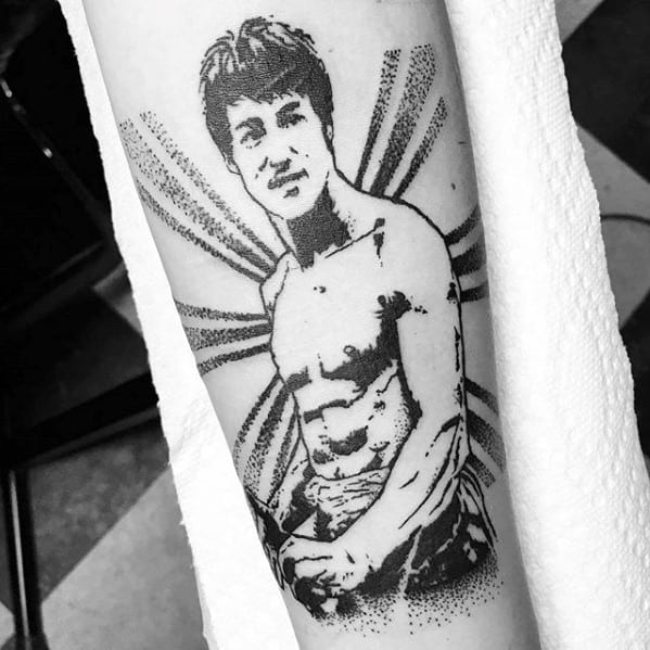 Guy With Bruce Lee Sun Rays Forearm Tattoo Design