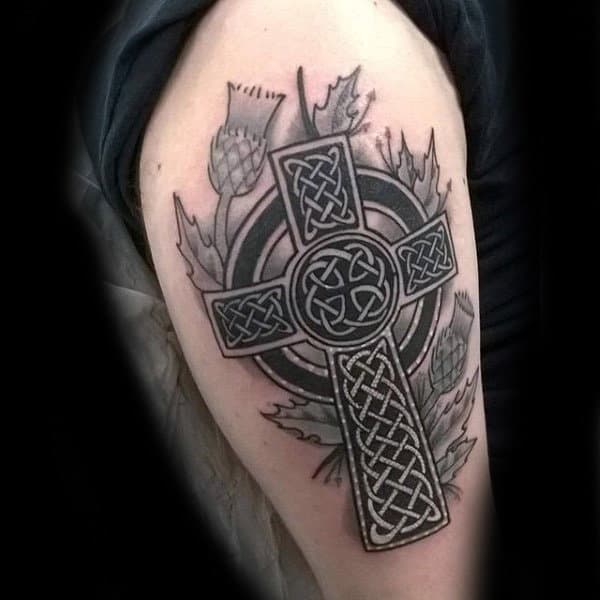 Guy With Celtic Cross Upper Arm Tattoo