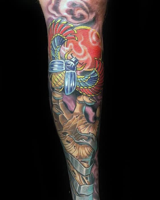 guy with colorful scarab egyptian themed leg sleeve tattoo