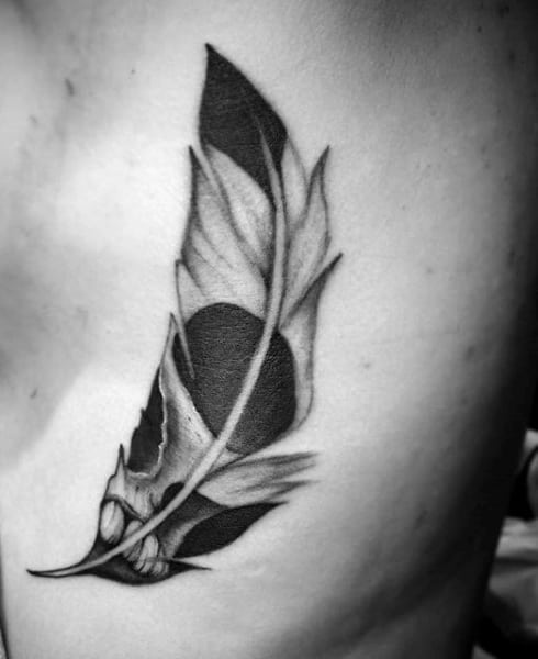 Guy With Cool Black Feather Tattoo On Ribs