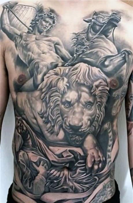 Guy With Cool Lion And Warrior Chest Tattoo
