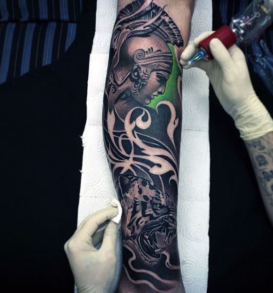 Guy With Creative Warrior Tattoo And Tiger On Forearms